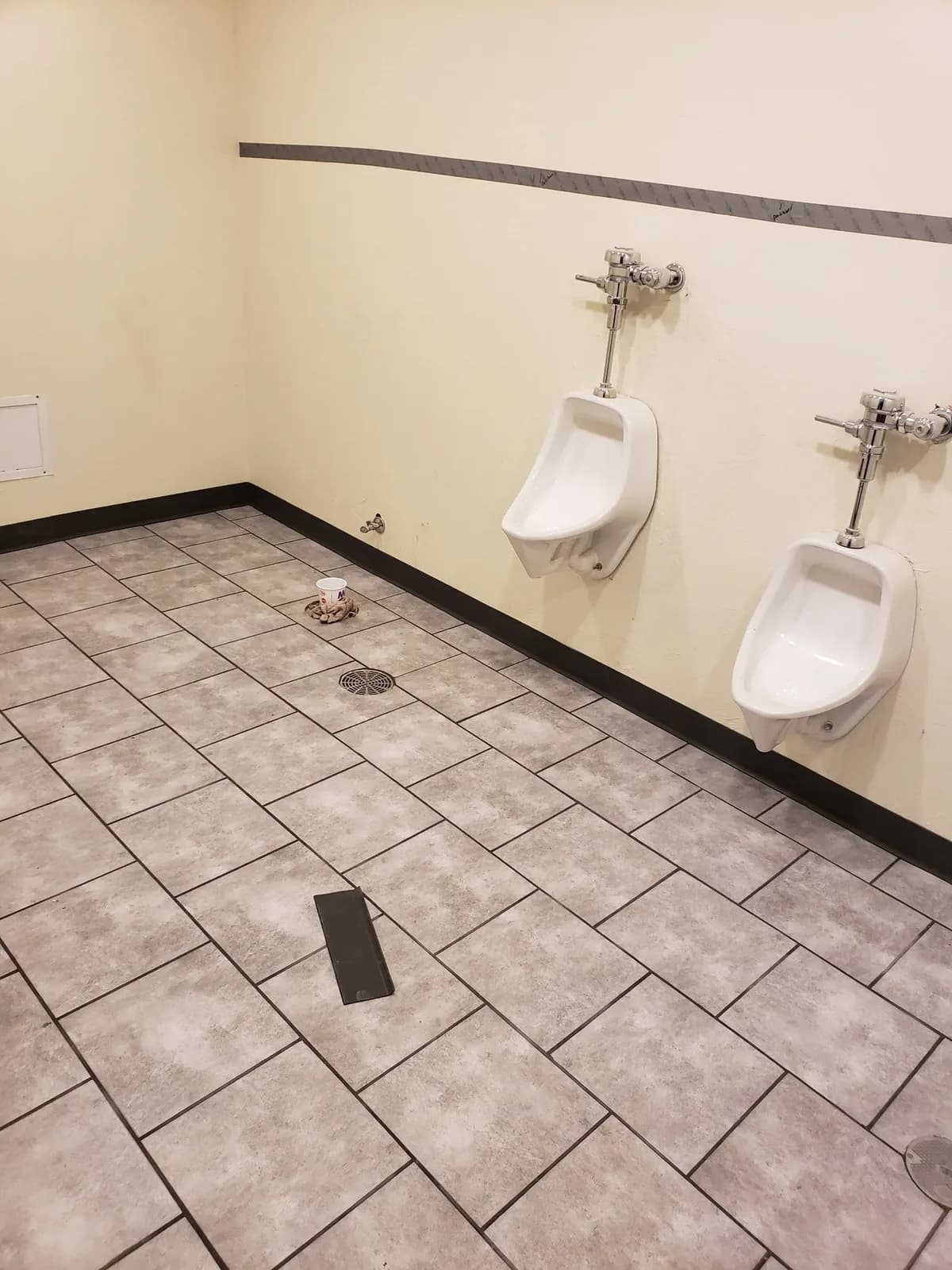 Finished commercial restroom with tile floor