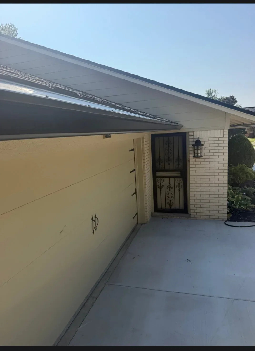 Gutter and downspout on a garage front